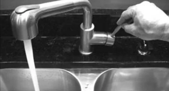 Open a hot water faucet