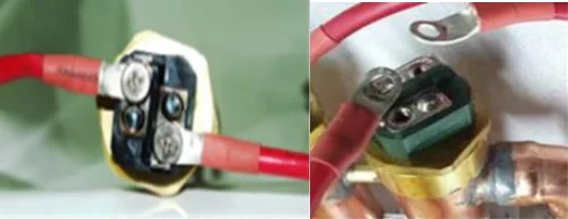 Remove both Phillips head screws from top of the element and fold away the red wires