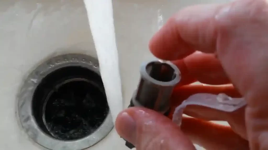 Cleaning the water inlet filter or screen with running water