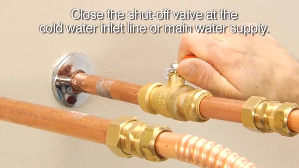 Close the shut-off valve at the cold water inlet to turn off water supply
