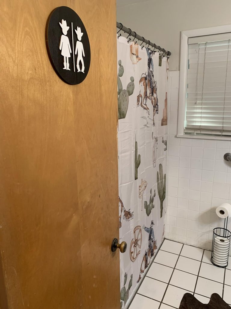 western bathroom door sign